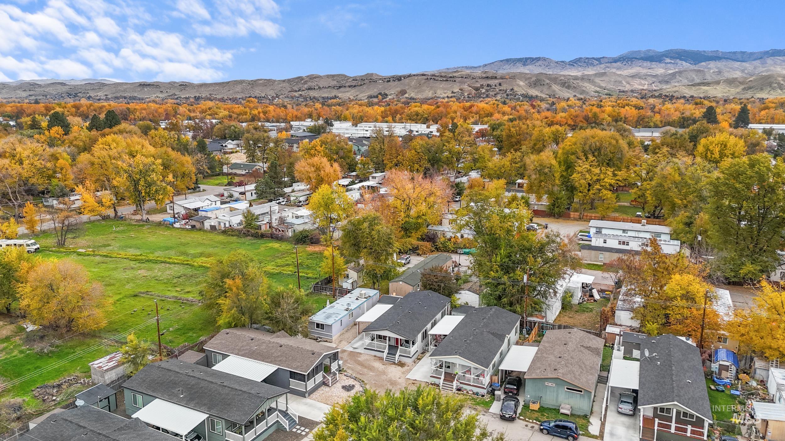 Aerial perspective of suburban area with a mountain backdrop
