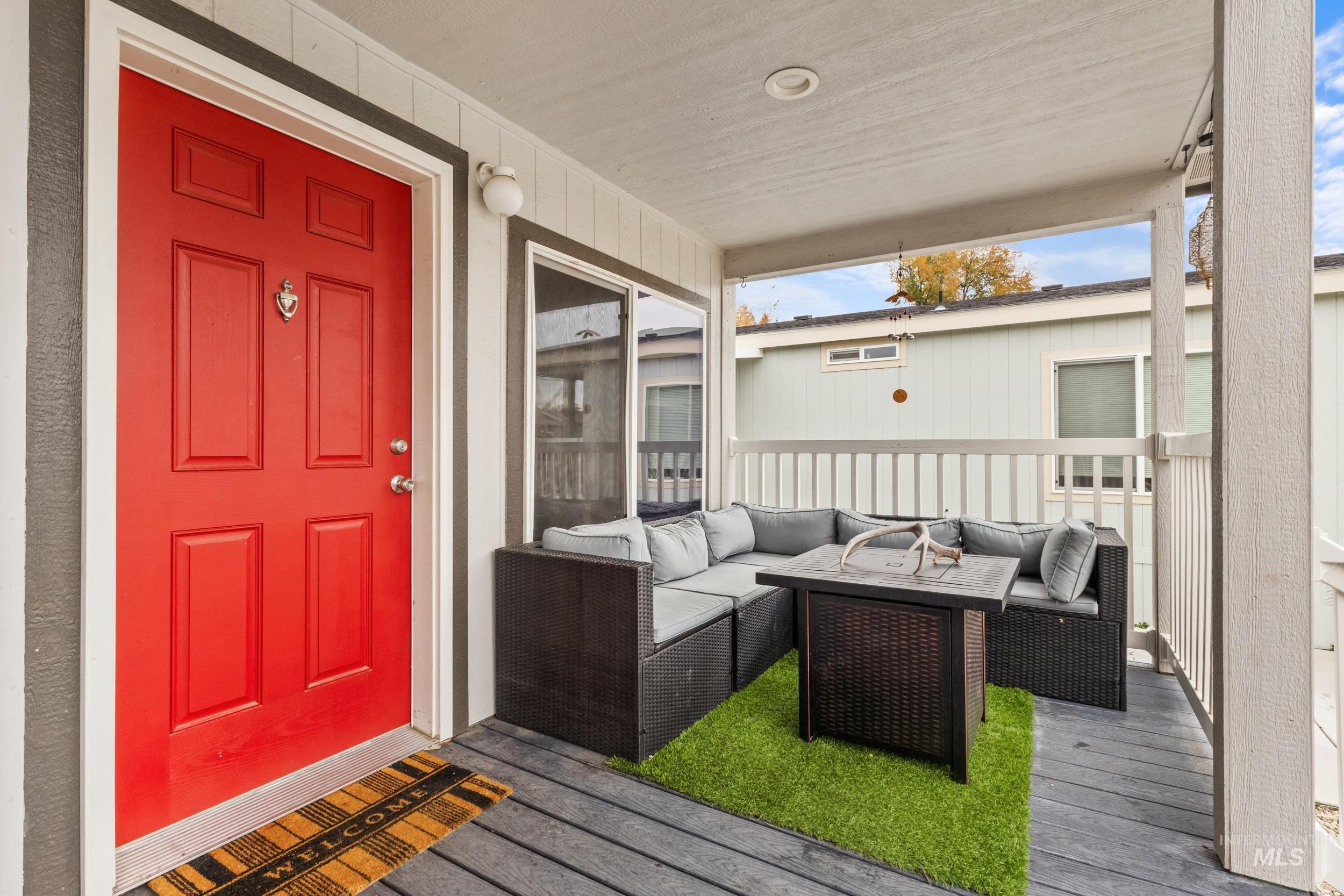 Wooden terrace featuring an outdoor hangout area