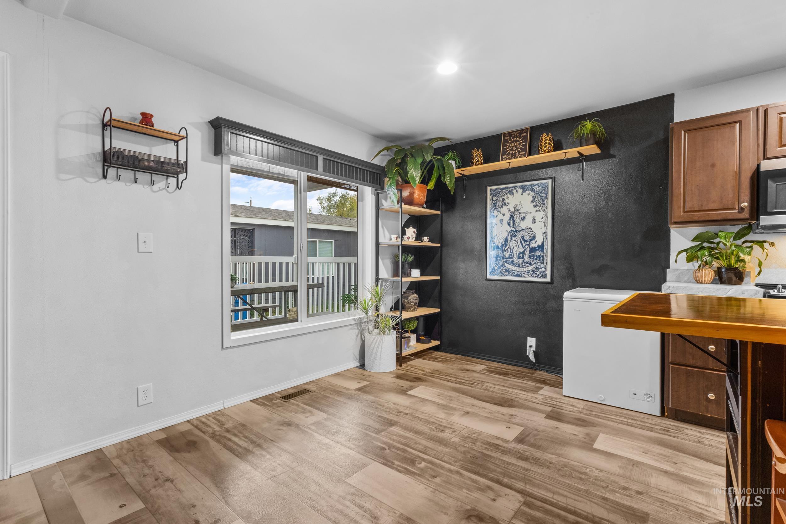 Dining space with light wood-style flooring