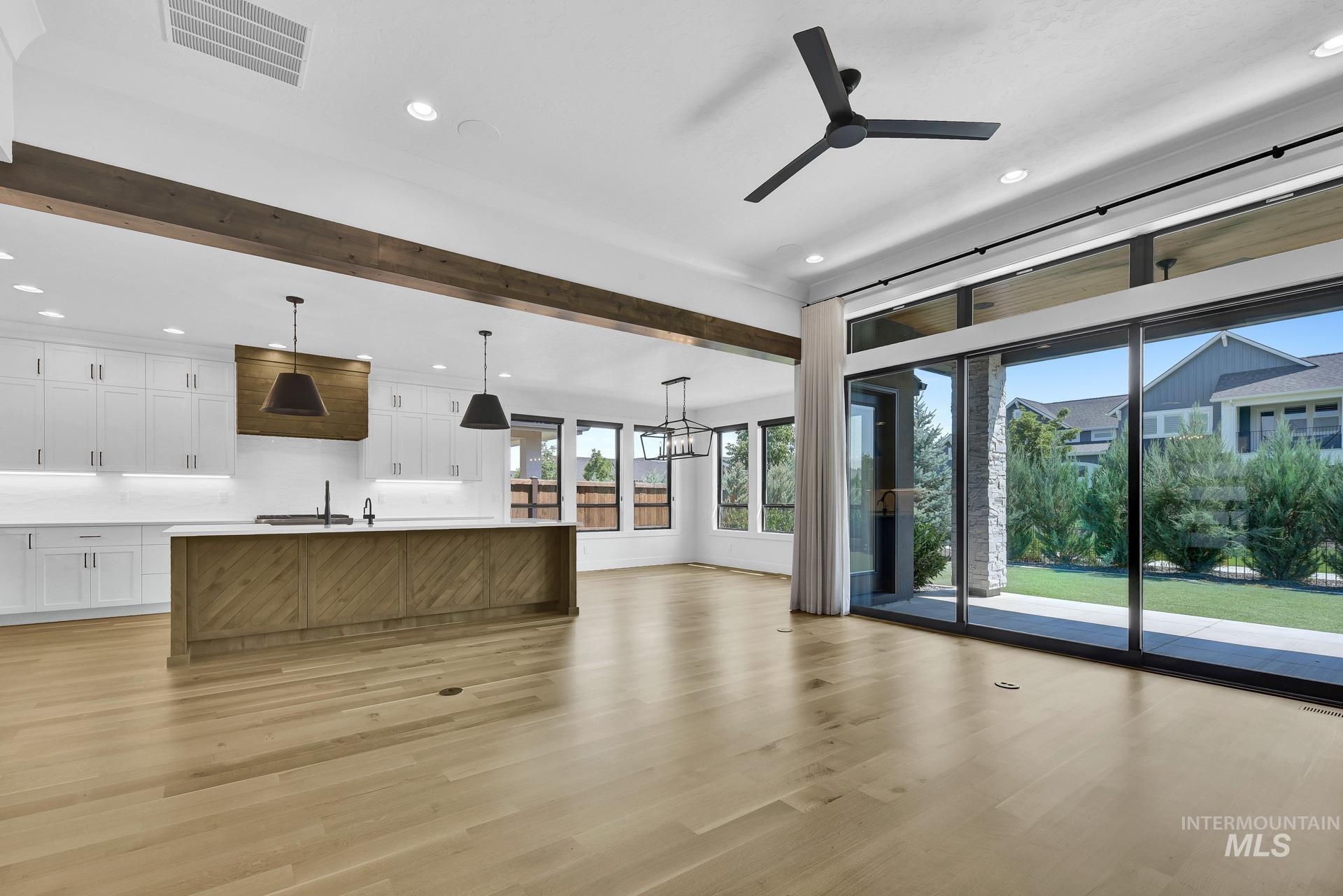 Unfurnished living room with recessed lighting, light wood-type flooring, and a ceiling fan