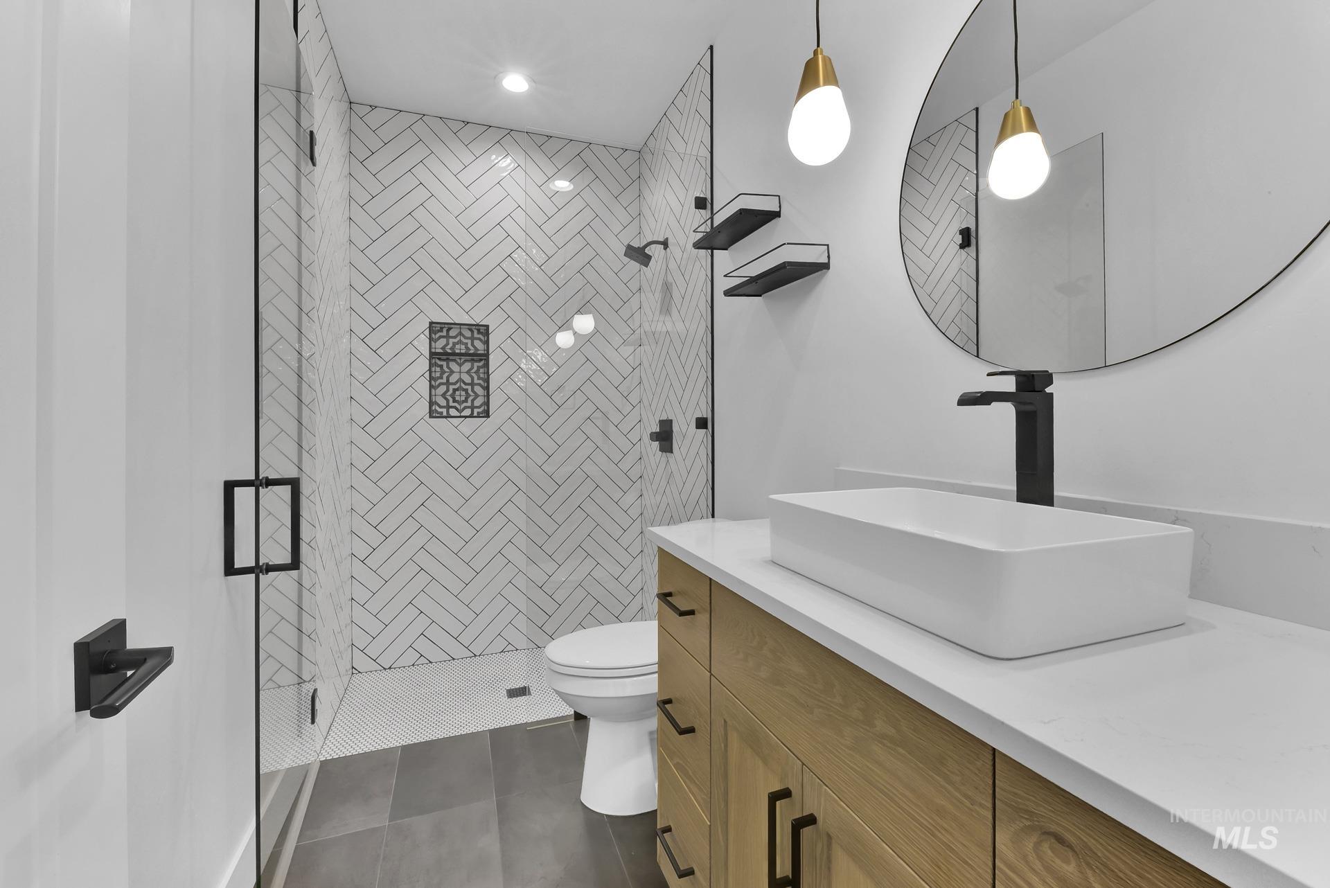 Full bath with vanity and a stall shower