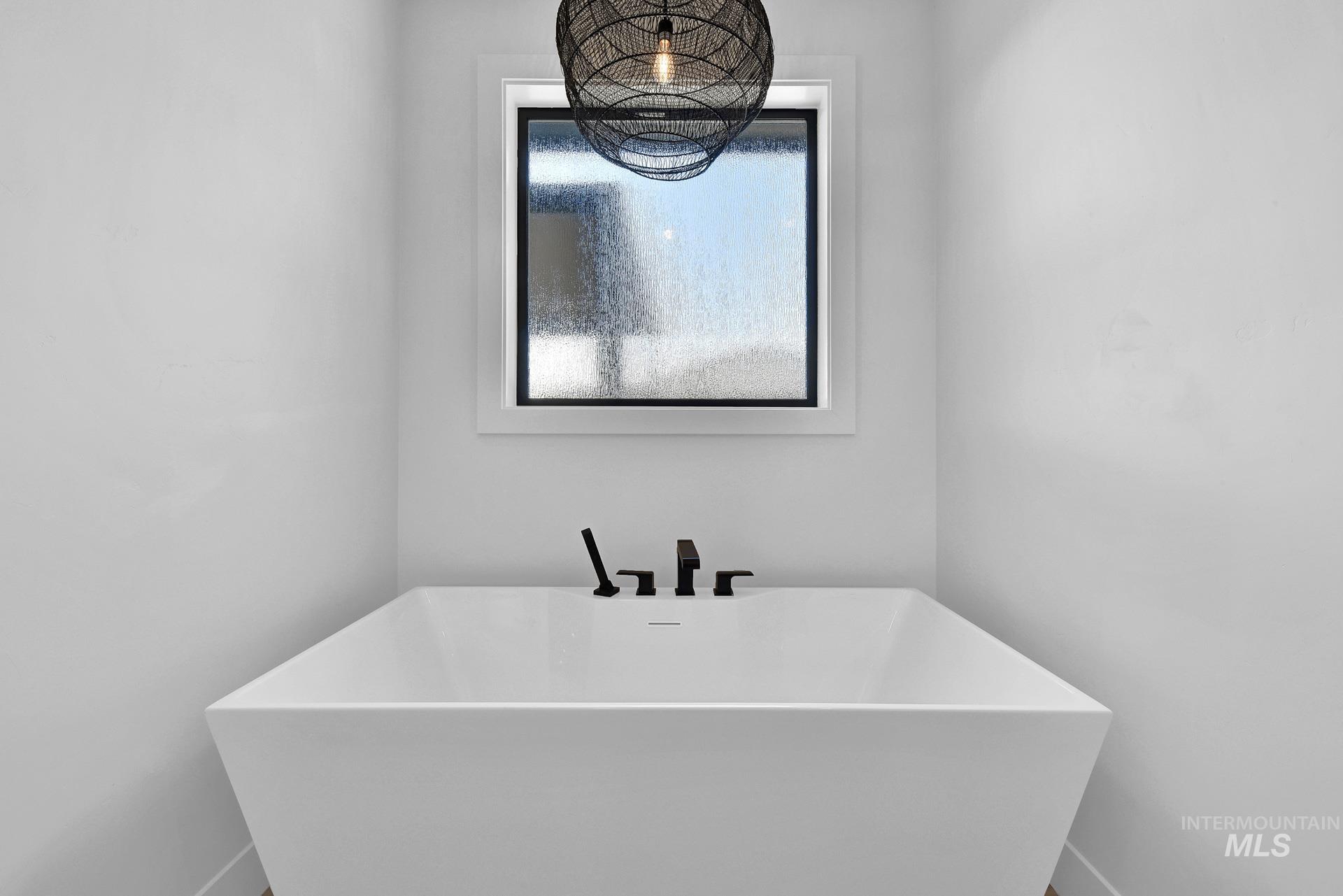 Full bathroom with a soaking tub