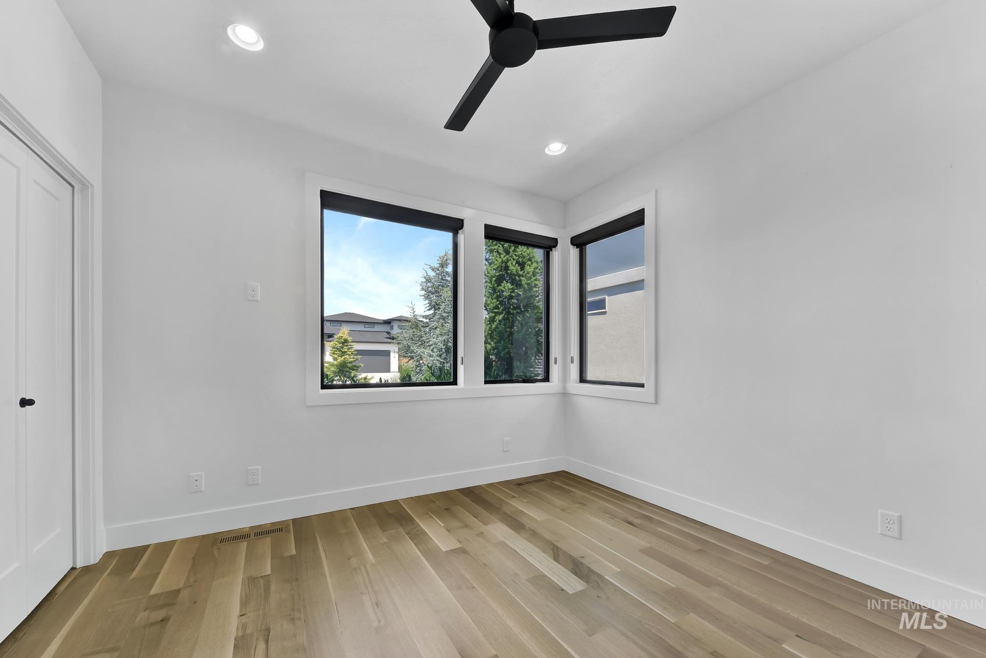 Unfurnished room with light wood-style floors, recessed lighting, and ceiling fan