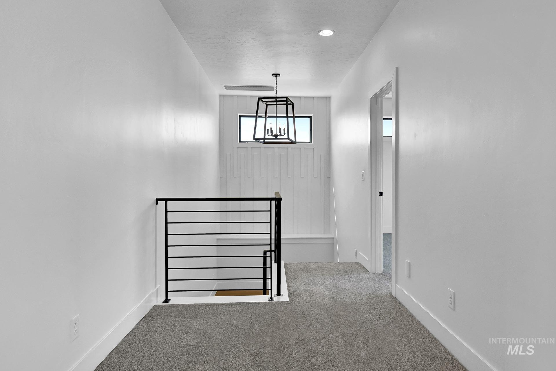 Stairway featuring carpet floors and baseboards