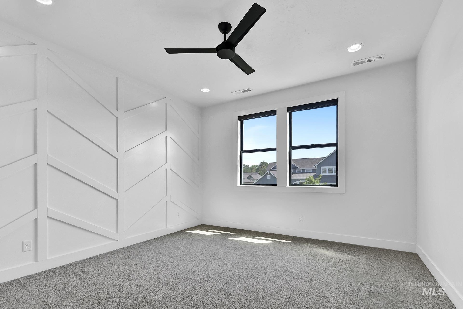Empty room with carpet, ceiling fan, and recessed lighting