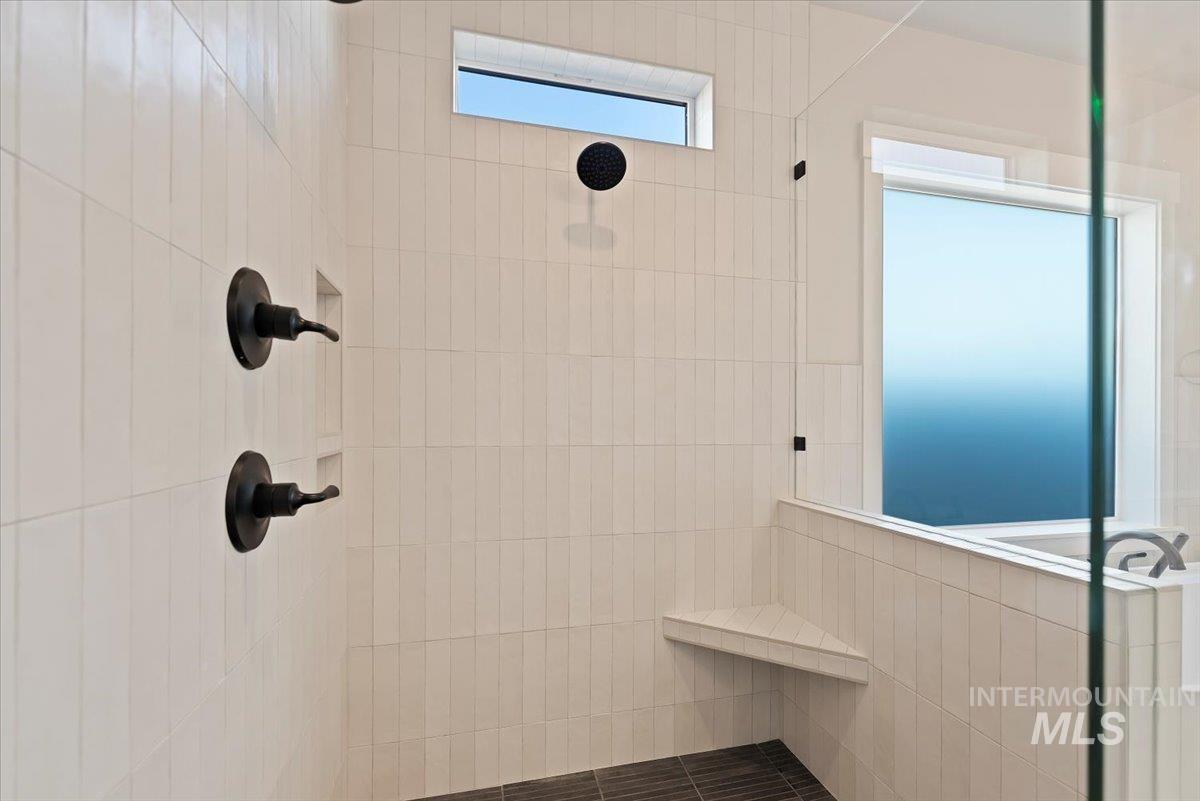 Bathroom featuring a tile shower