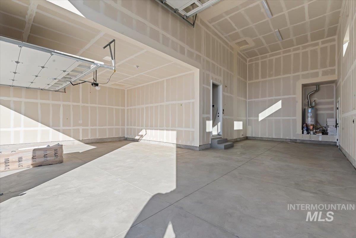 Garage featuring water heater