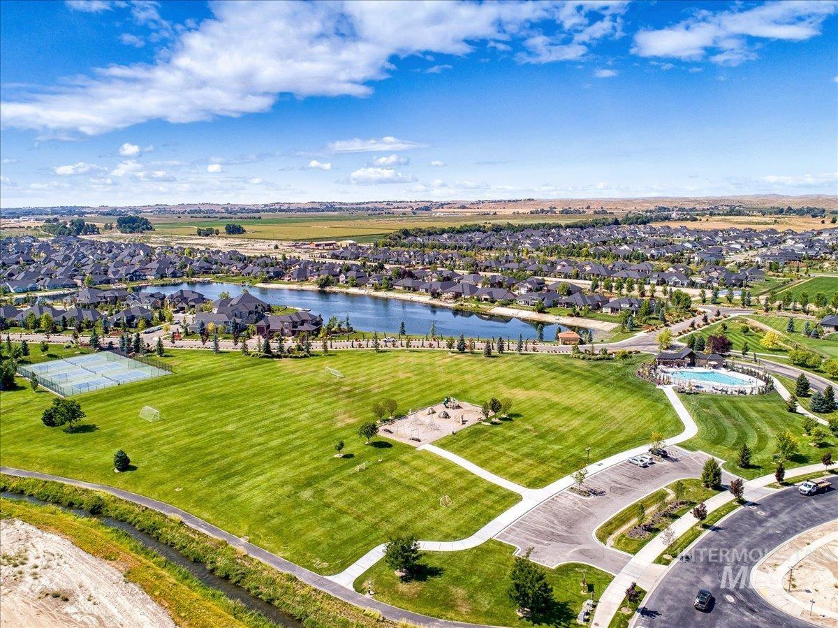 Aerial perspective of suburban area with a nearby body of water