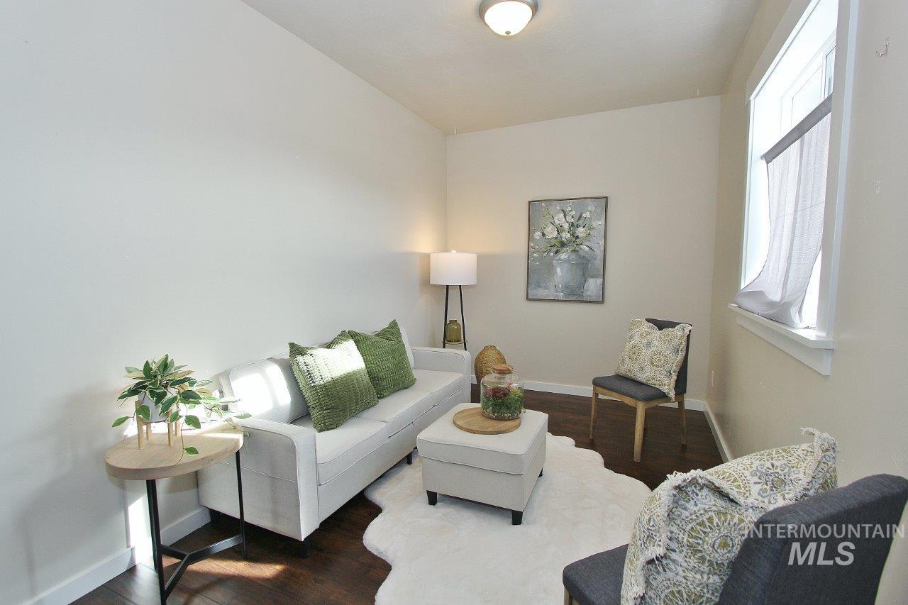 Living area with dark wood-style flooring