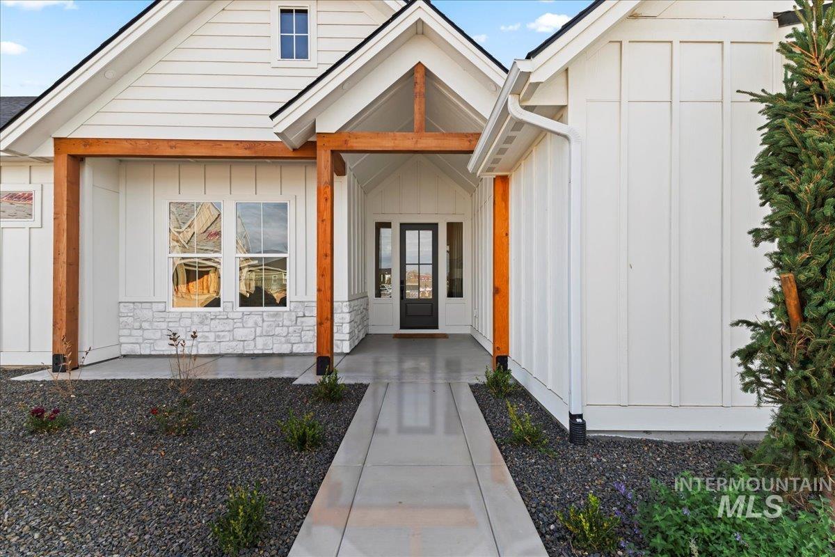 Entrance to property featuring board and batten siding