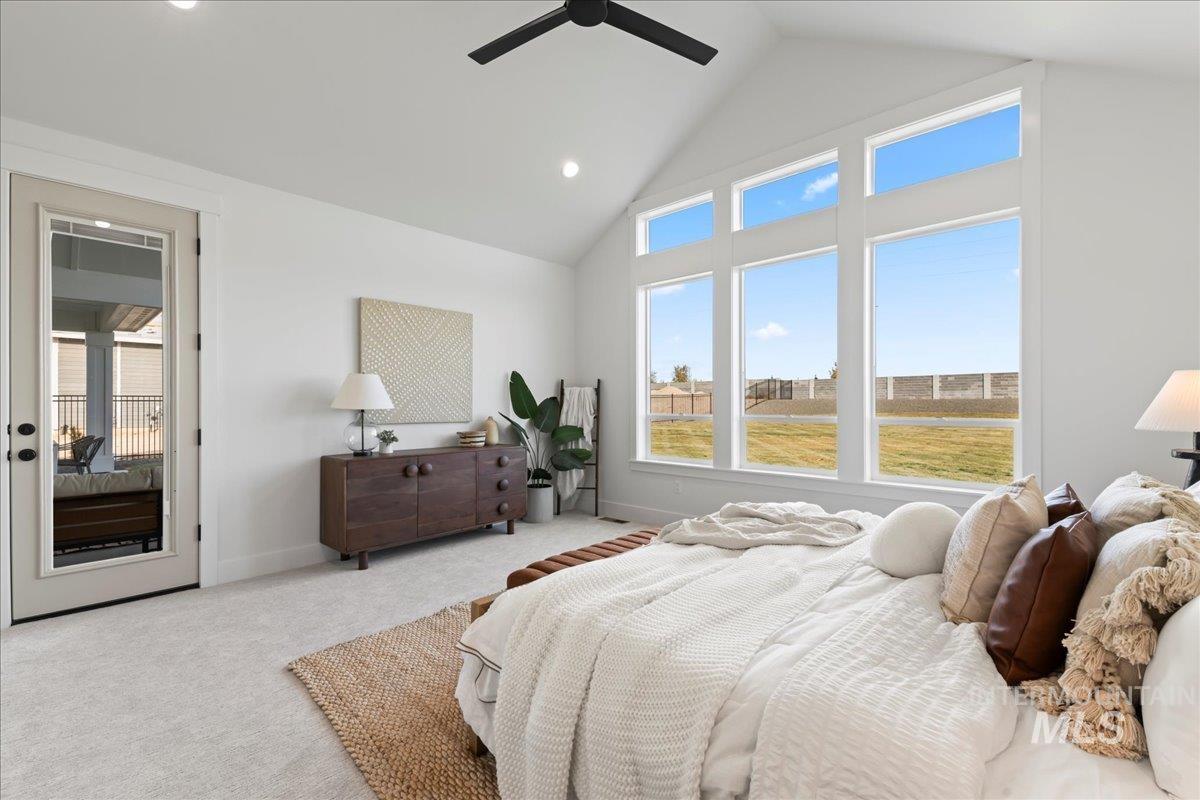 Carpeted bedroom featuring high vaulted ceiling, recessed lighting, a ceiling fan, and access to outside