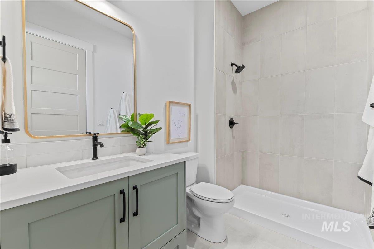 Bathroom with vanity and a shower stall