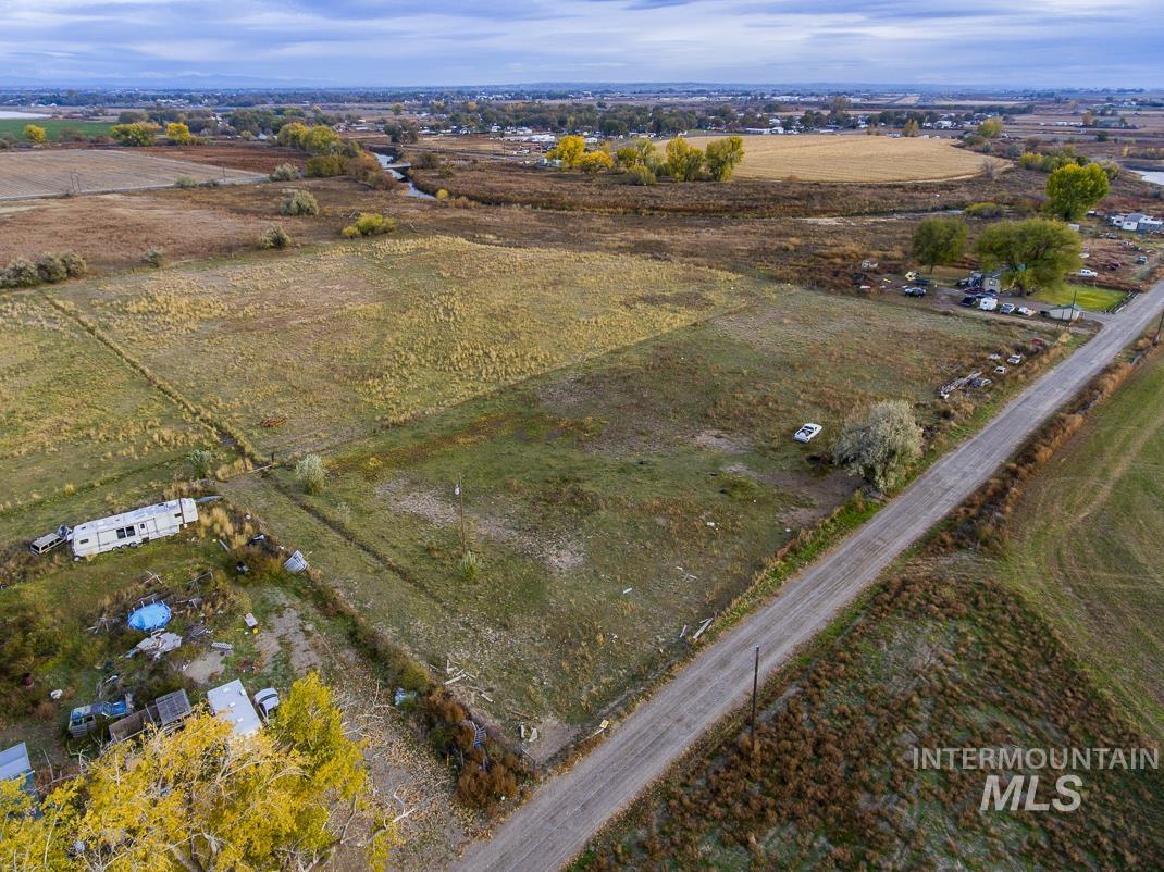 Aerial view of property and surrounding area featuring rural landscape