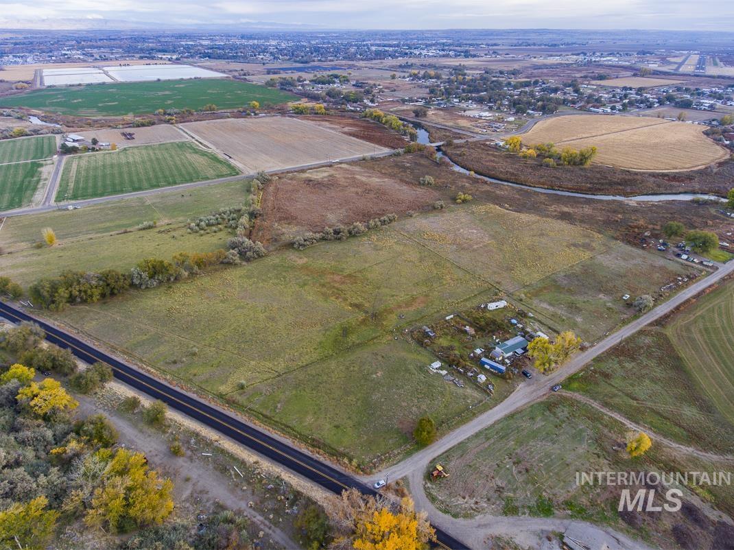 Aerial view of property and surrounding area with rural landscape and abundant farmland