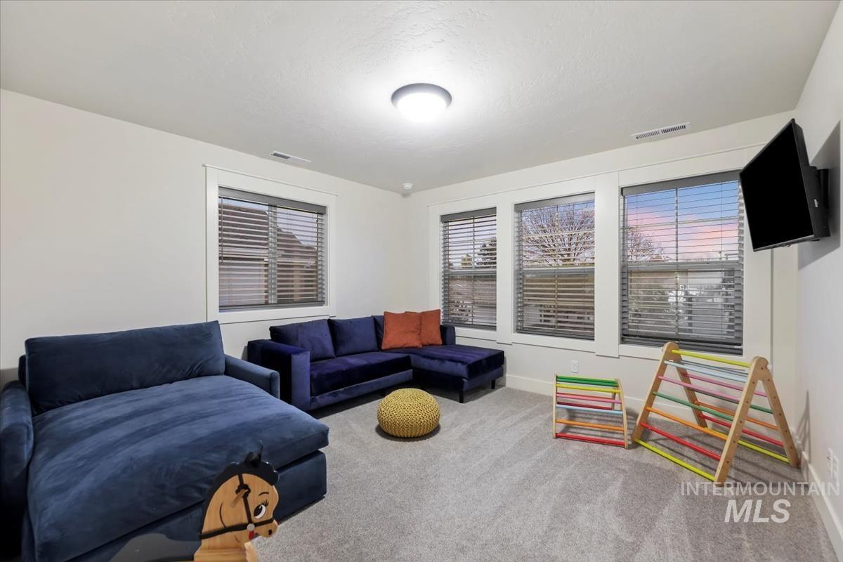 Living area with carpet and baseboards