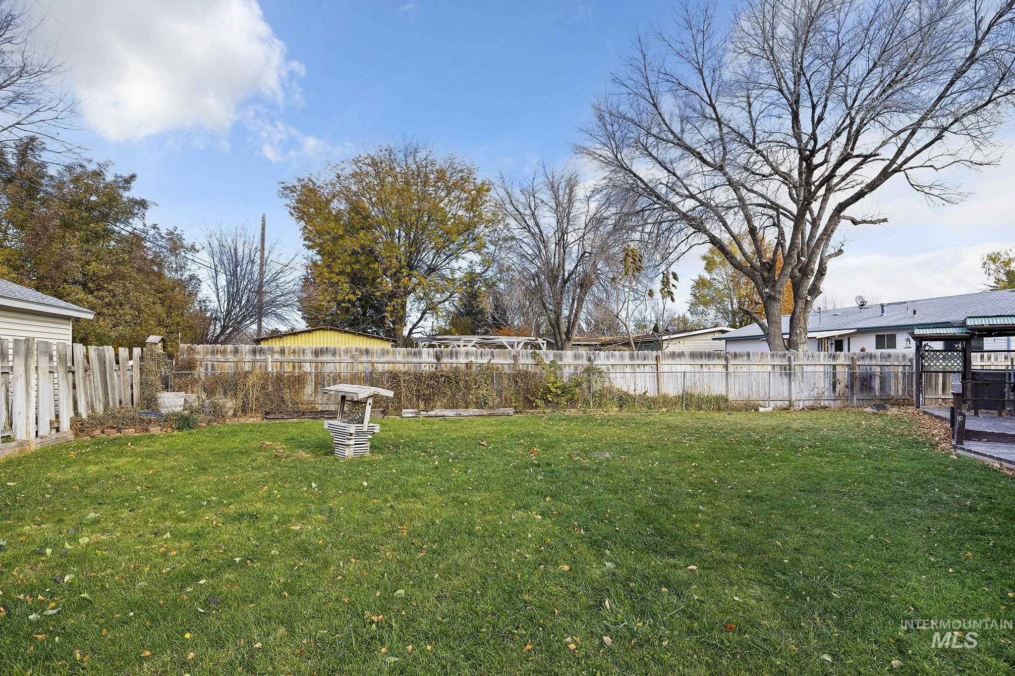 View of fenced backyard