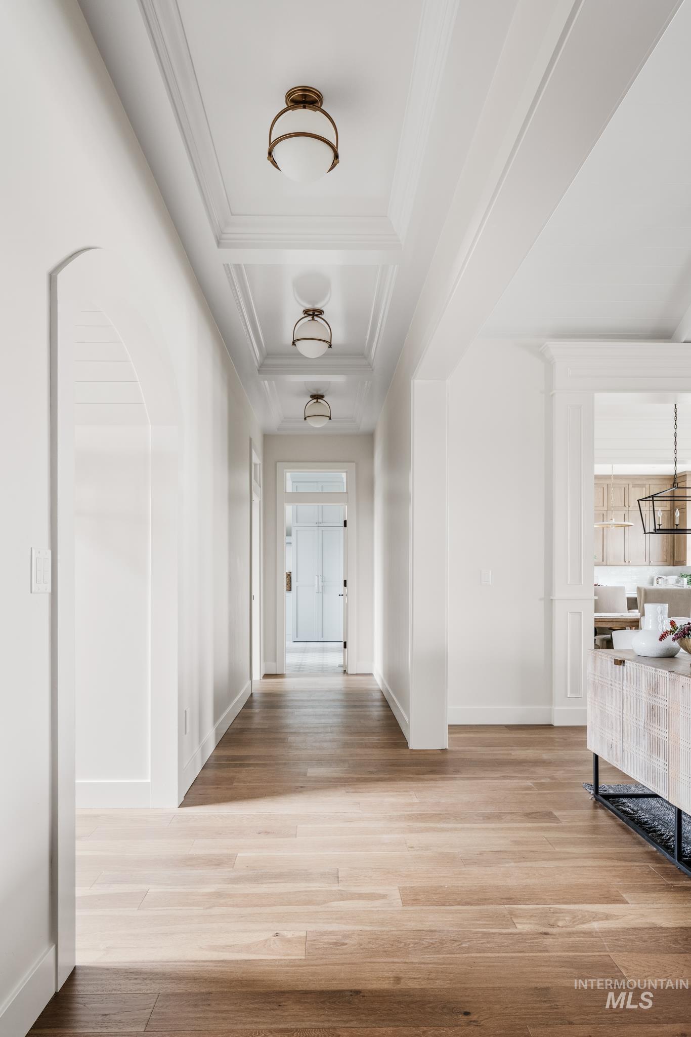 Hall featuring light wood-style floors and baseboards