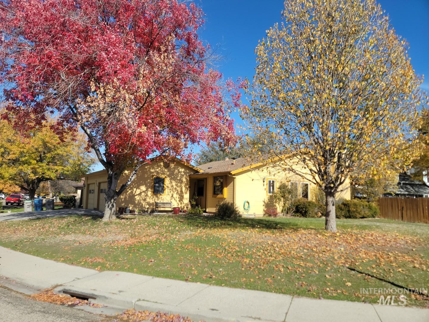 View of front of home featuring a garage and driveway