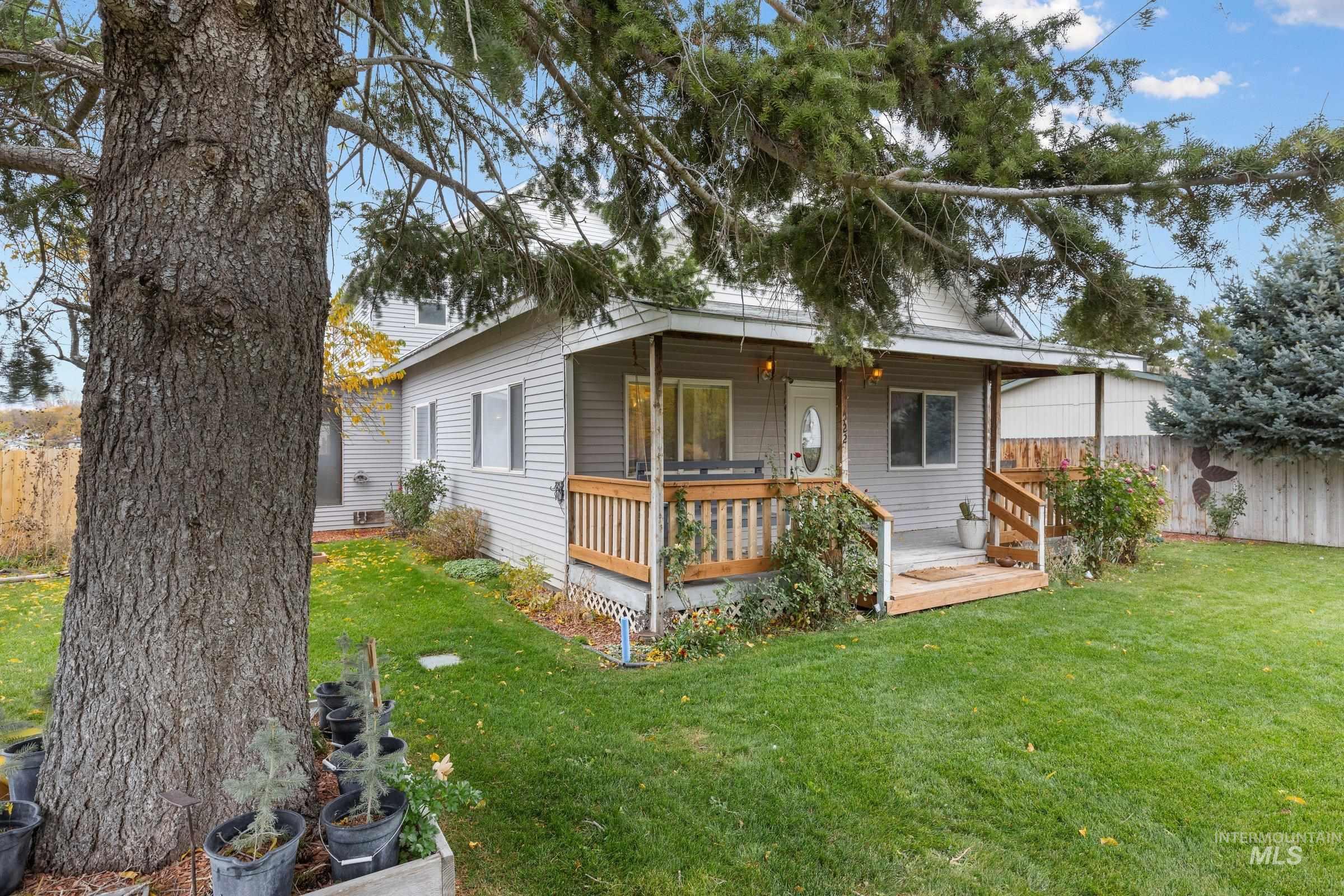 View of front facade with a wooden deck