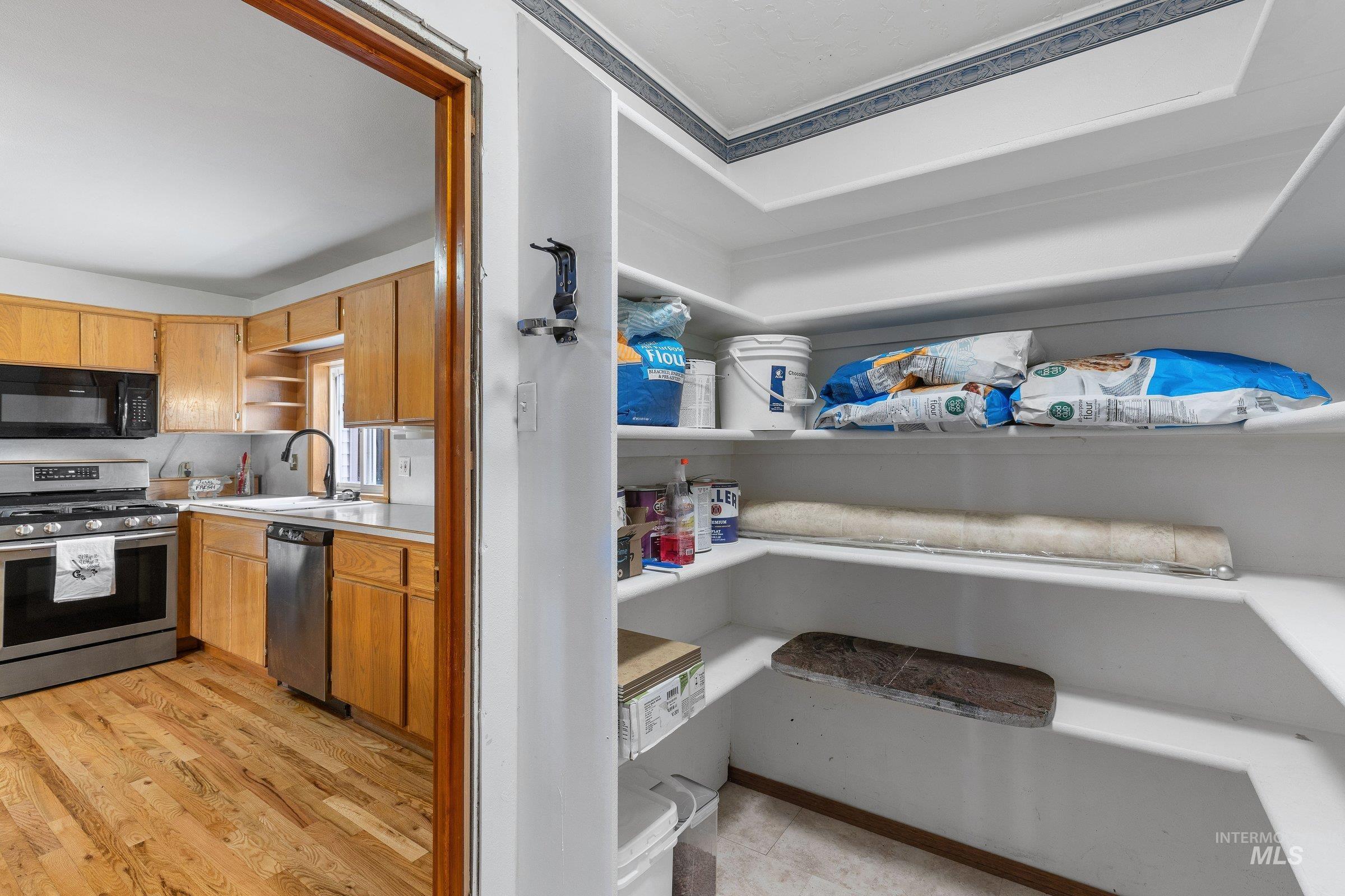 Pantry featuring a sink