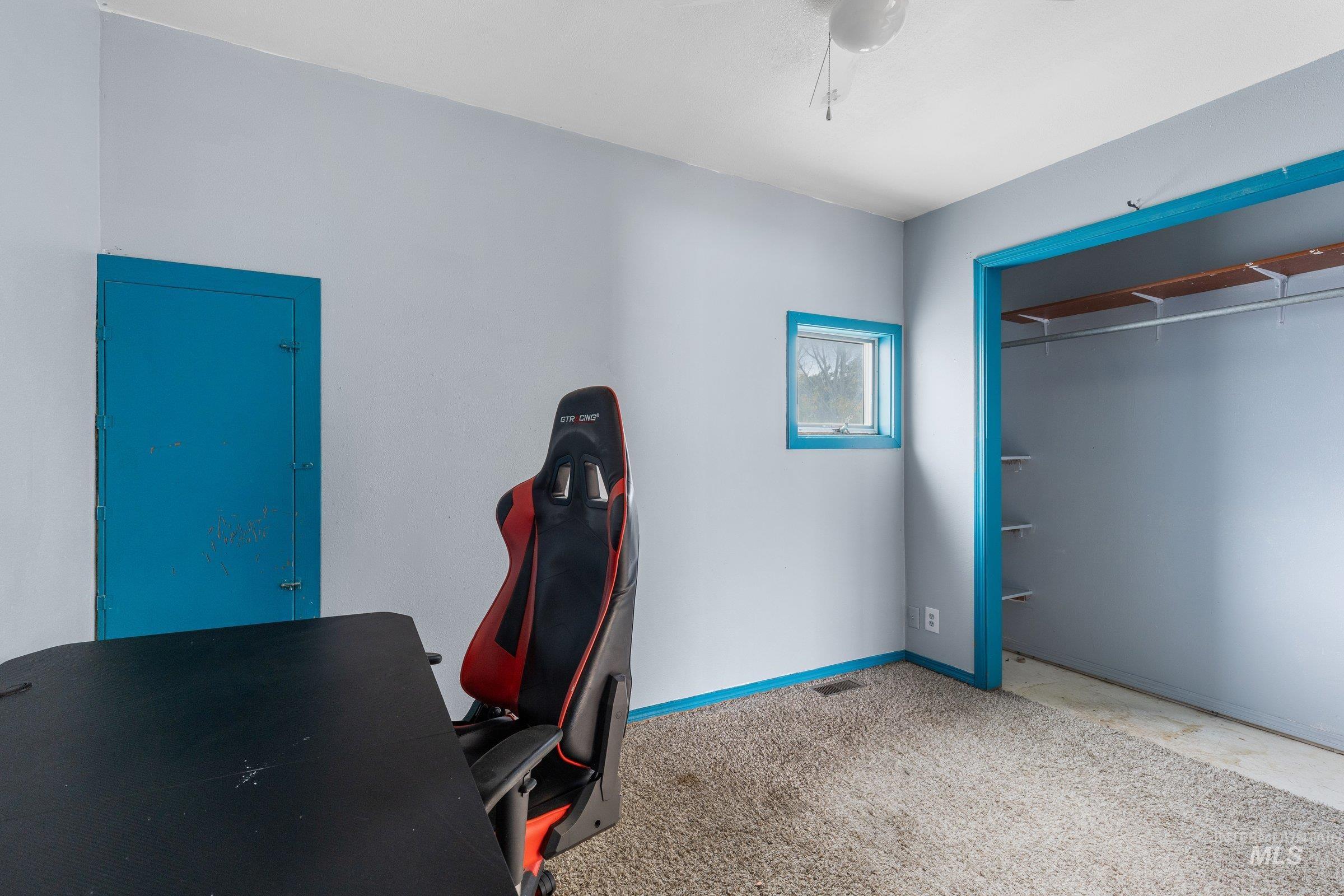 Office area with baseboards and carpet flooring