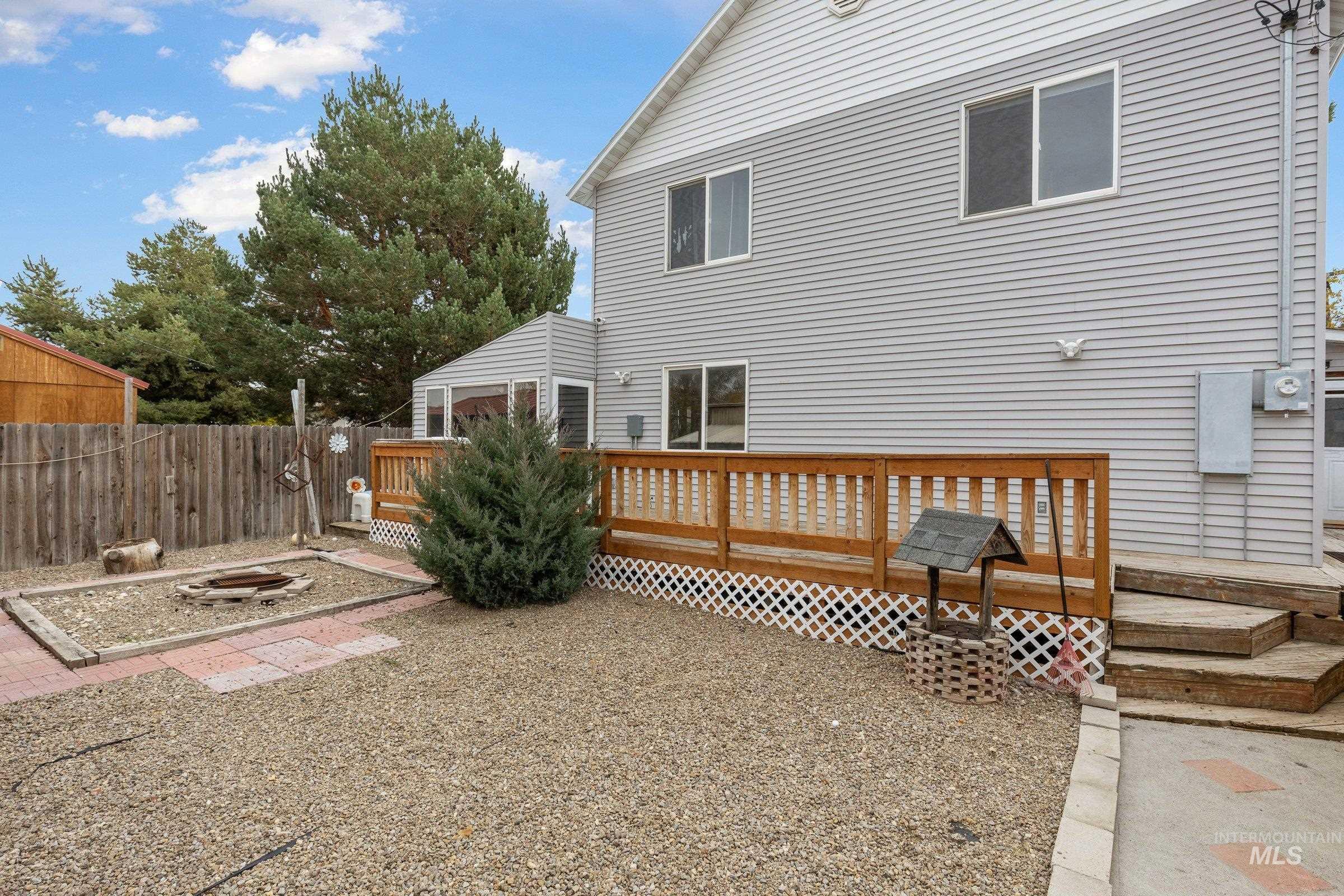 Back of property with a wooden deck