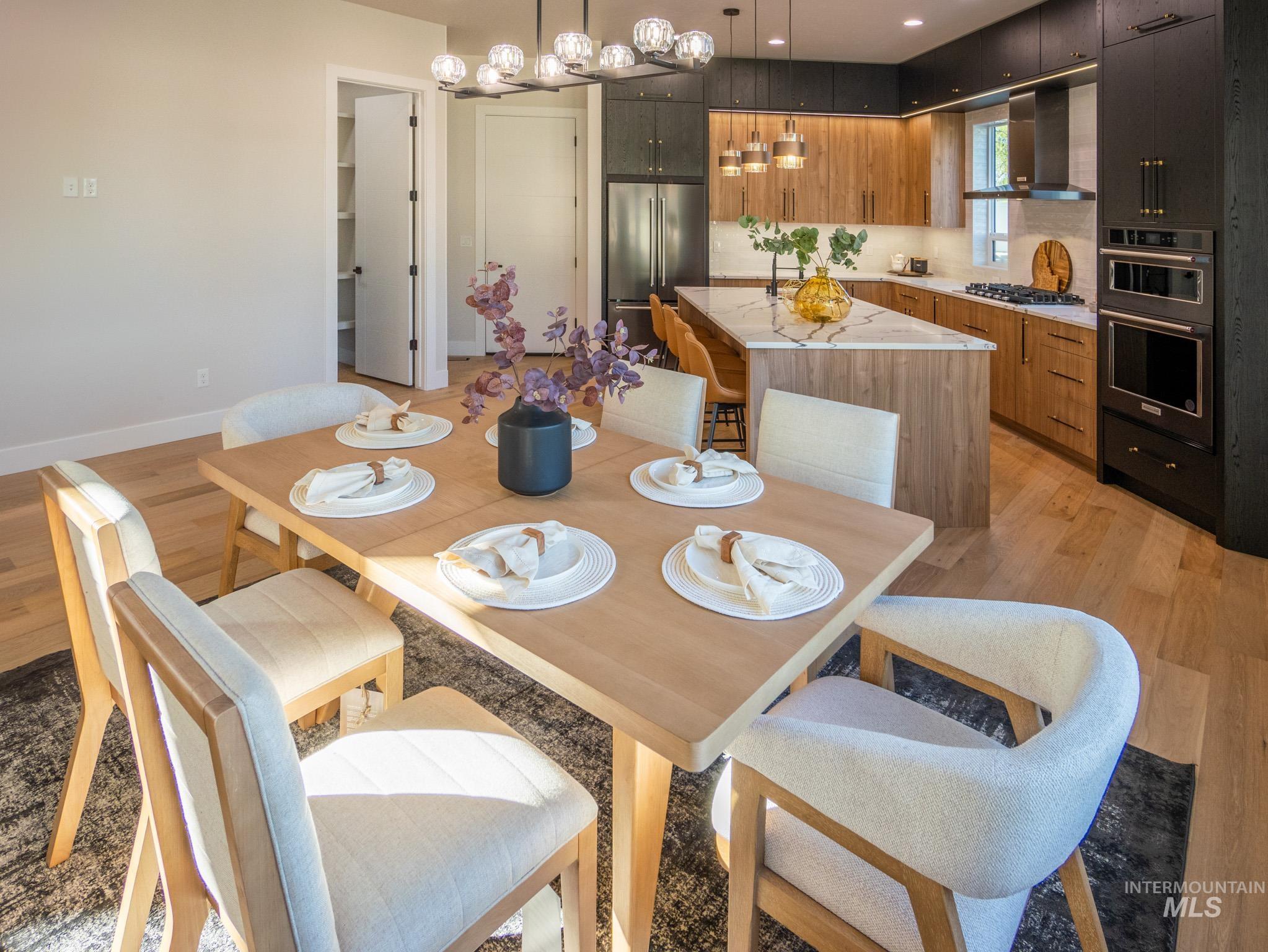 Dining space featuring light wood-style floors and baseboards