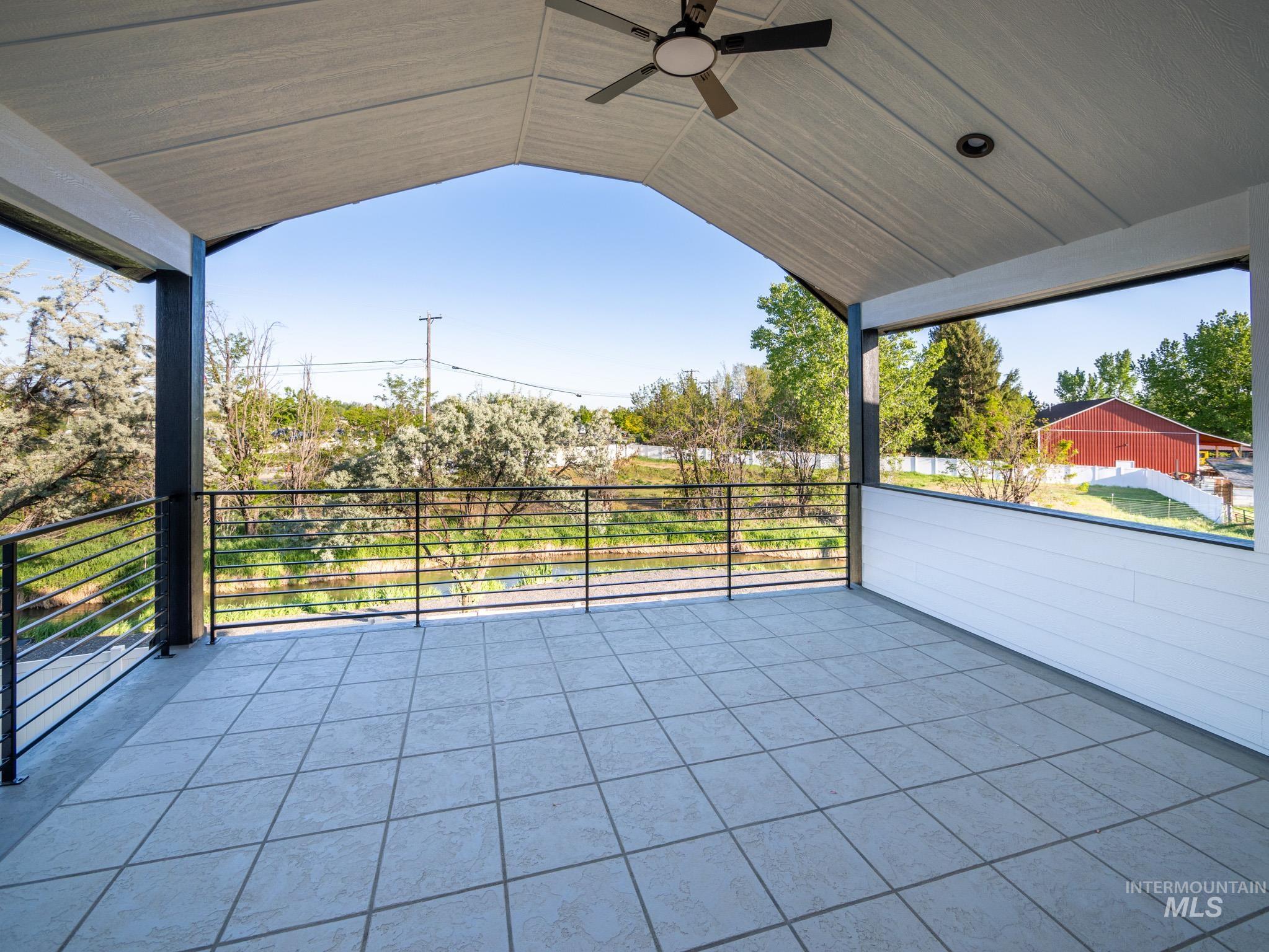 View of patio / terrace featuring ceiling fan