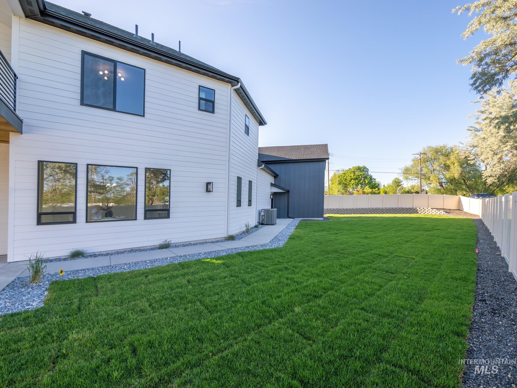 Back of house featuring a fenced backyard and a patio