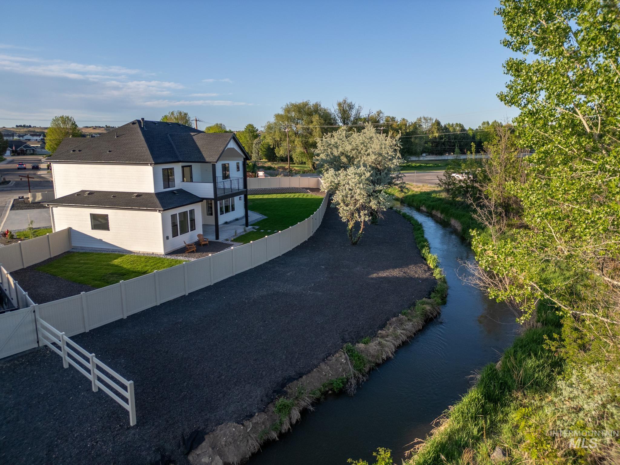 View of subject property with a nearby body of water