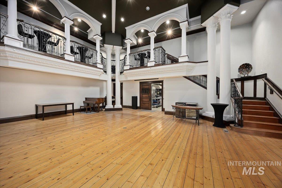 Building lobby featuring stairs and a high ceiling