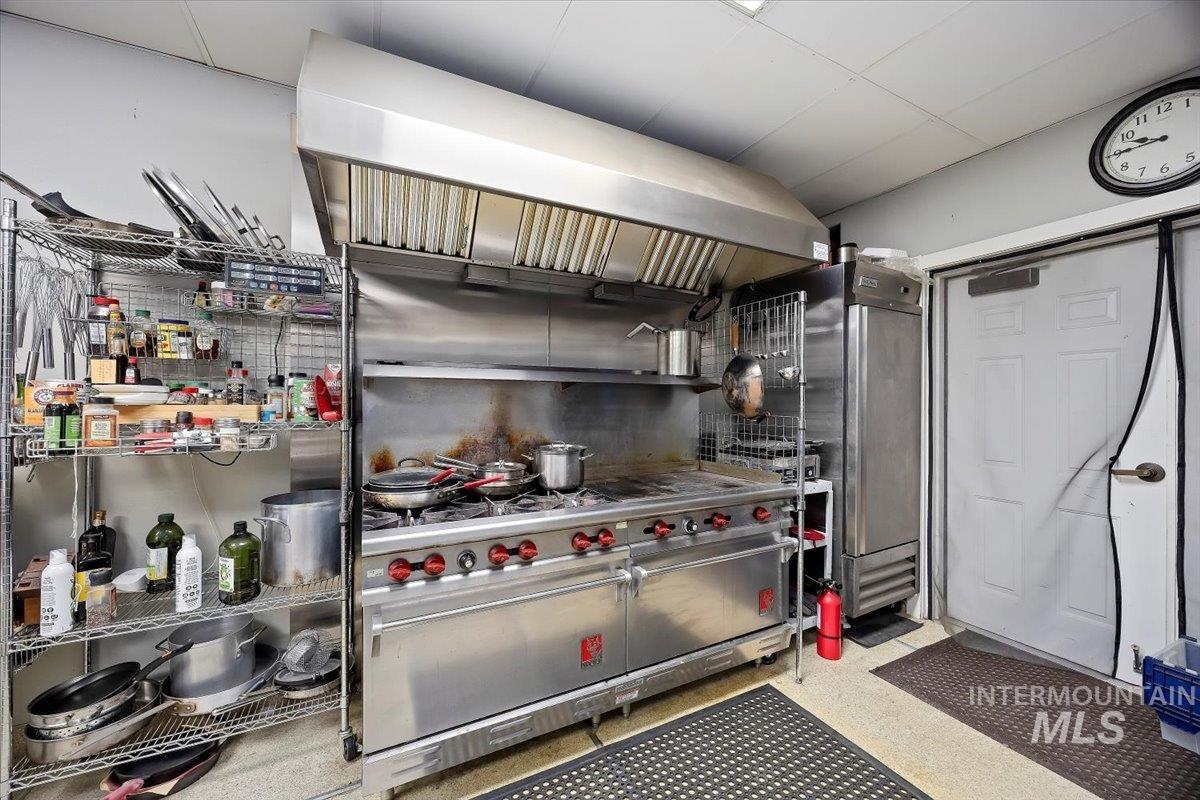 Kitchen featuring ventilation hood