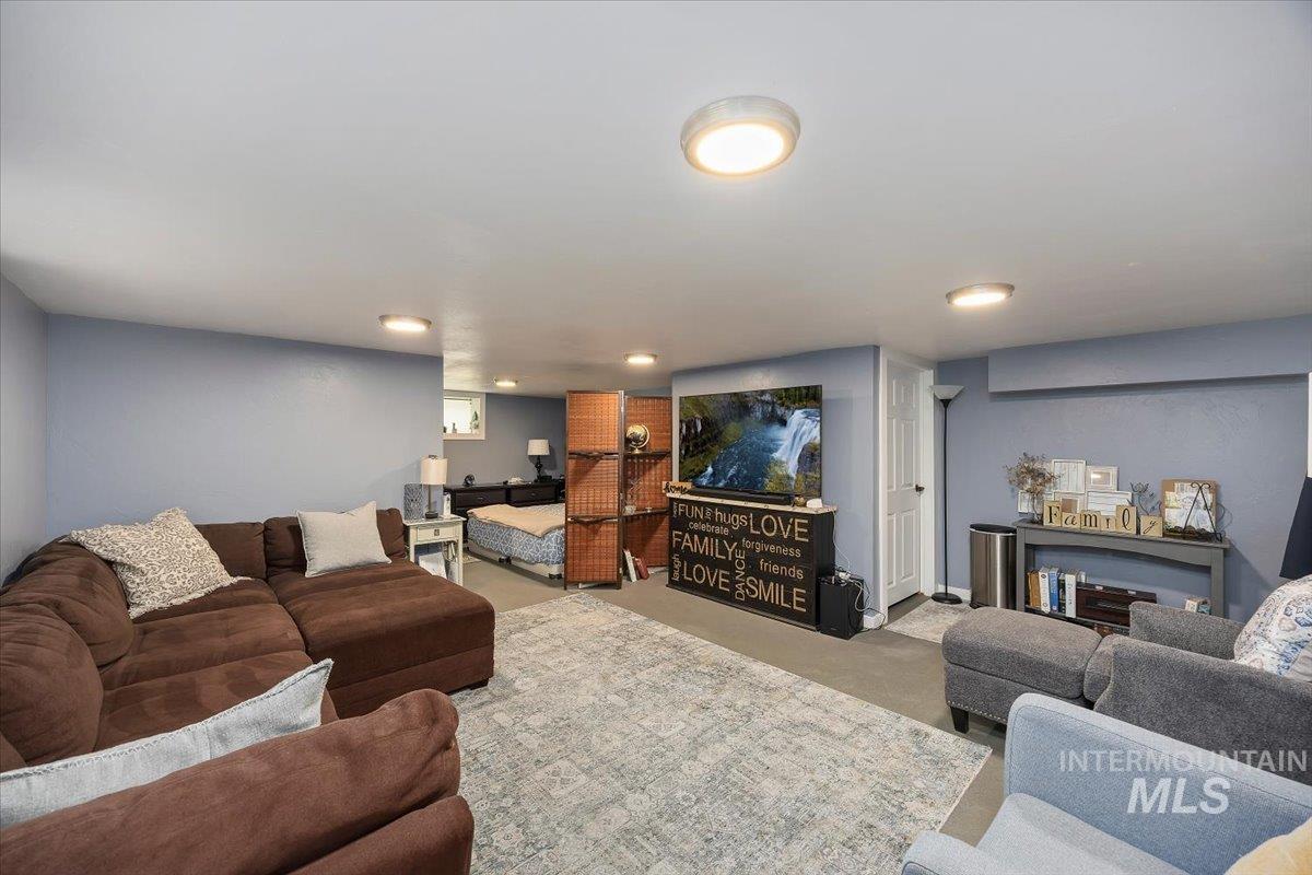 Living area featuring carpet flooring