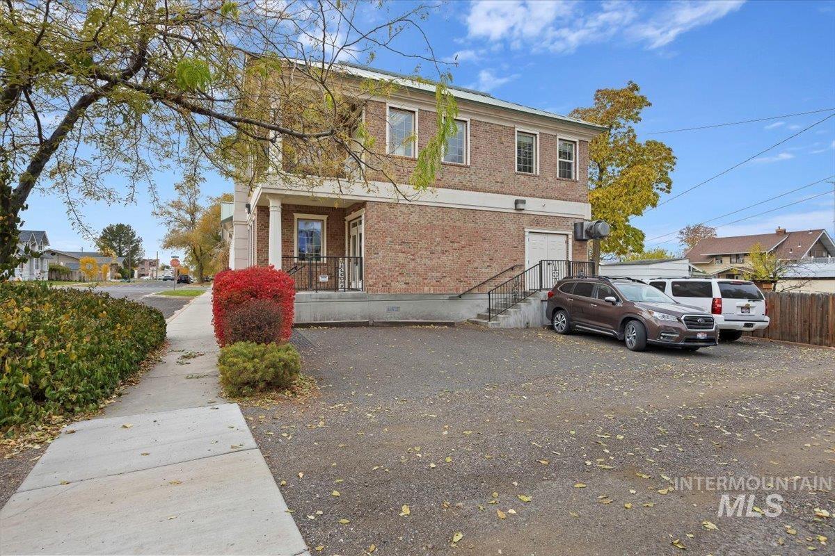 View of front of property with brick siding