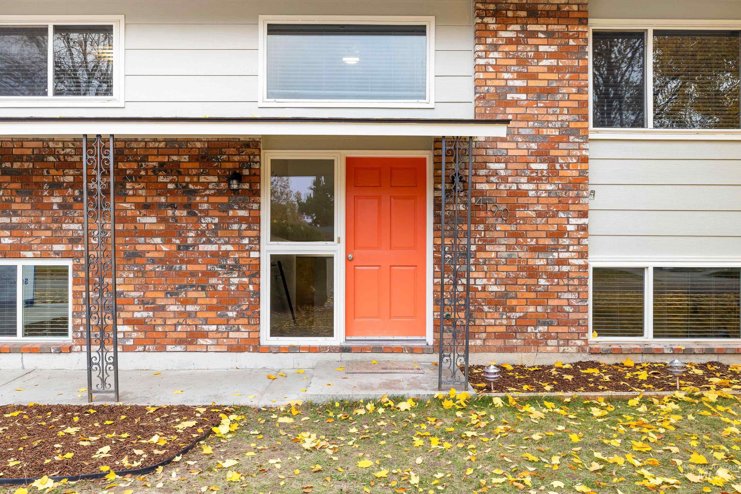 Entrance to property with brick siding