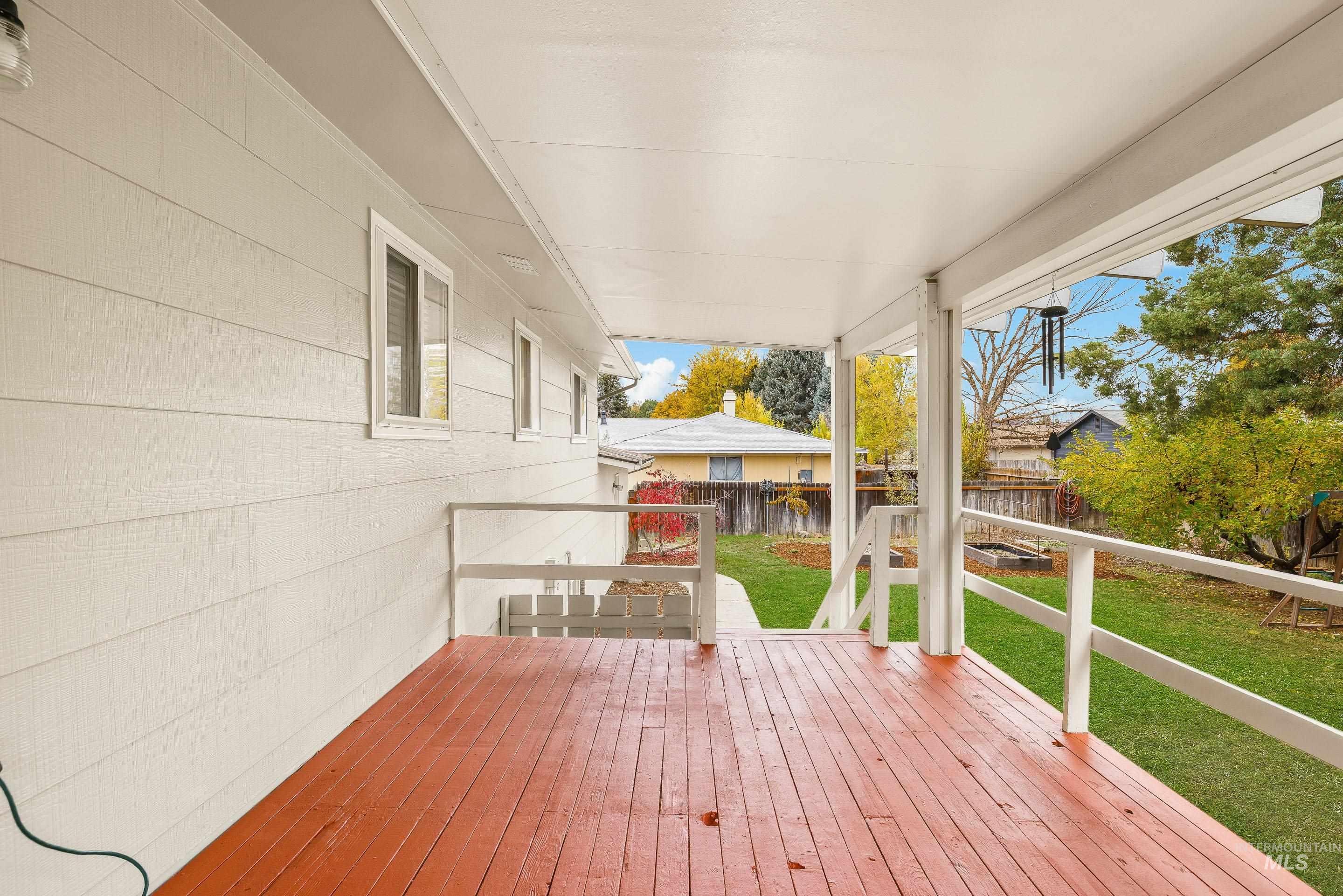 Wooden deck featuring a fenced backyard