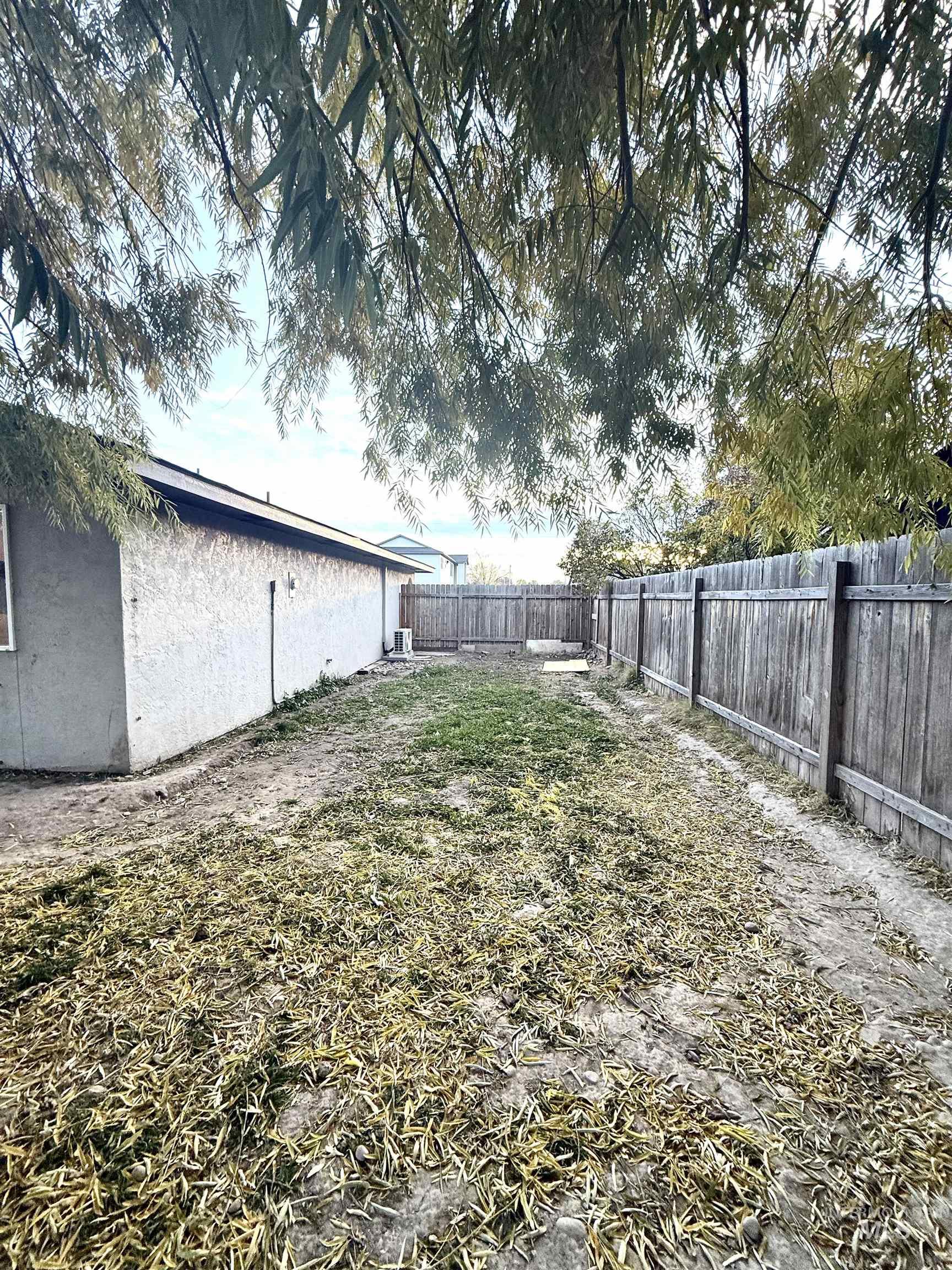 View of fenced backyard