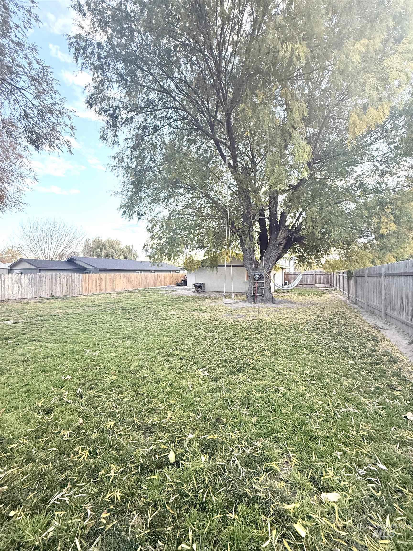 View of fenced backyard