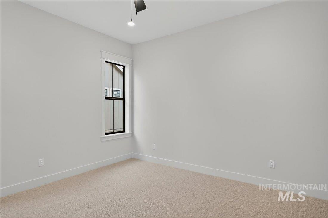 Spare room featuring light carpet, recessed lighting, and ceiling fan