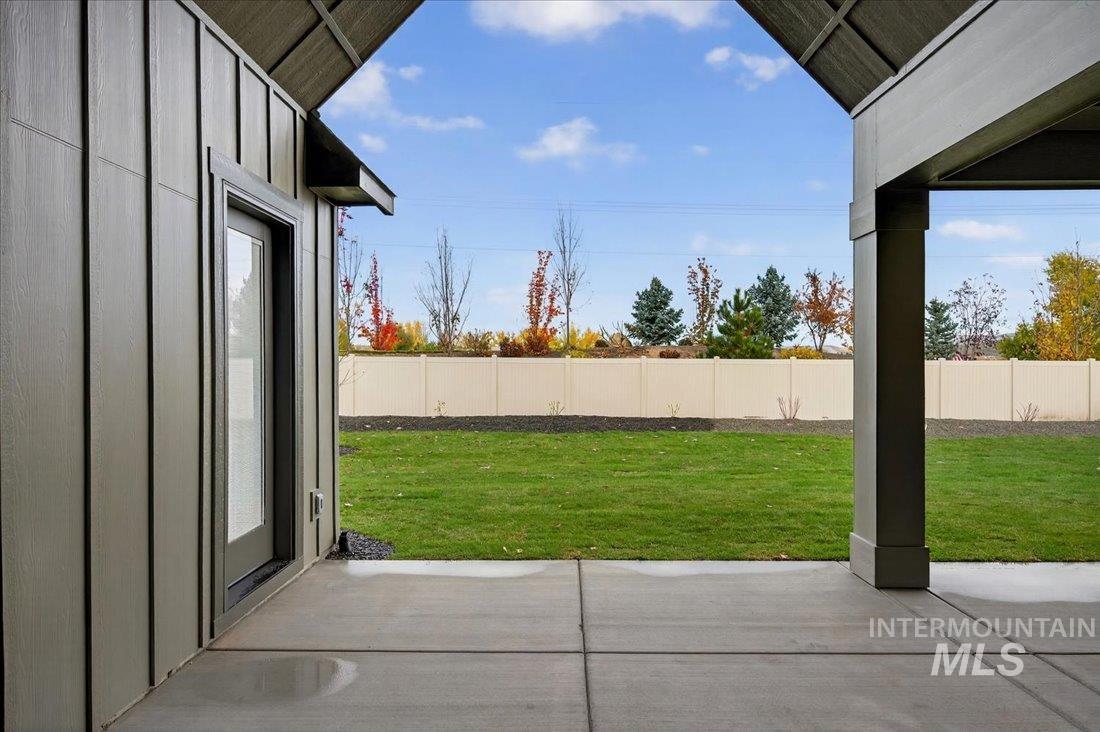 Fenced backyard with a patio area