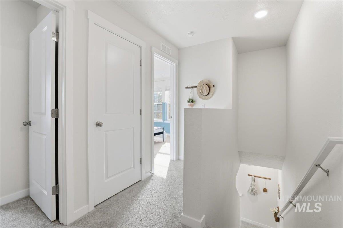 Bathroom with light carpet and recessed lighting