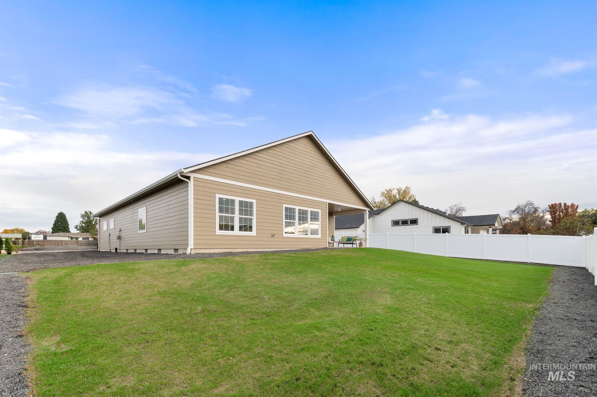 Rear view of property featuring a patio area