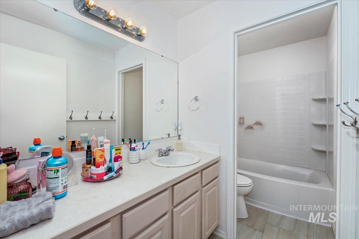 Full bath featuring vanity and tub / shower combination