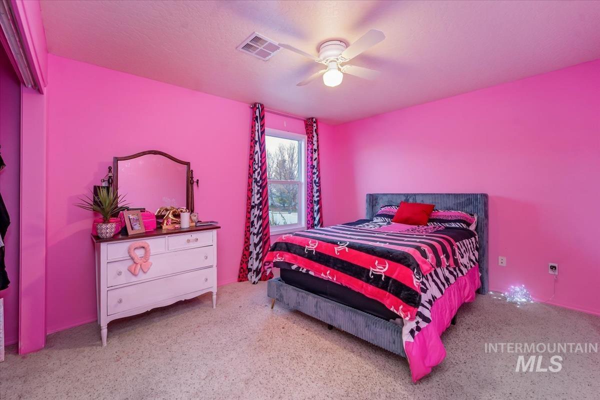 Bedroom with a ceiling fan