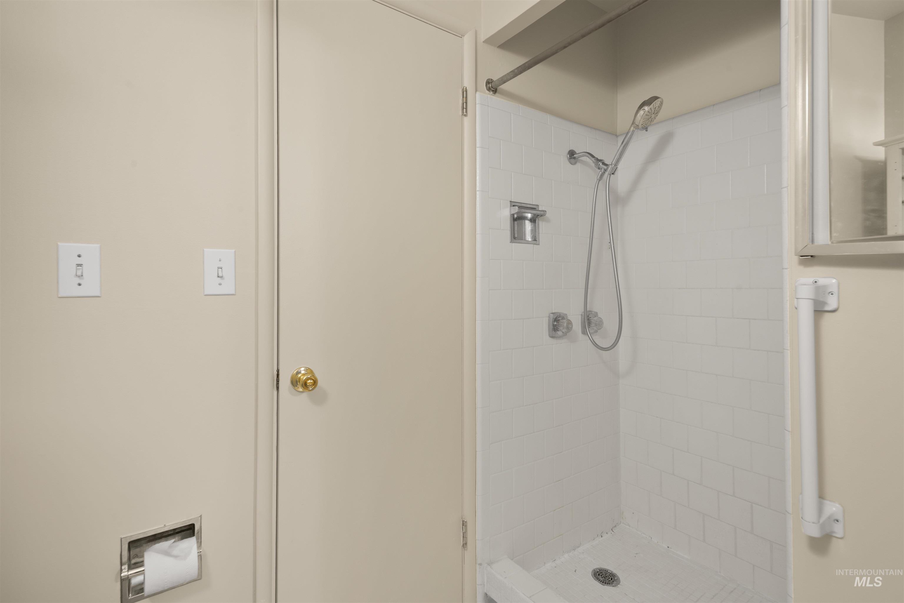 Full bath featuring a stall shower