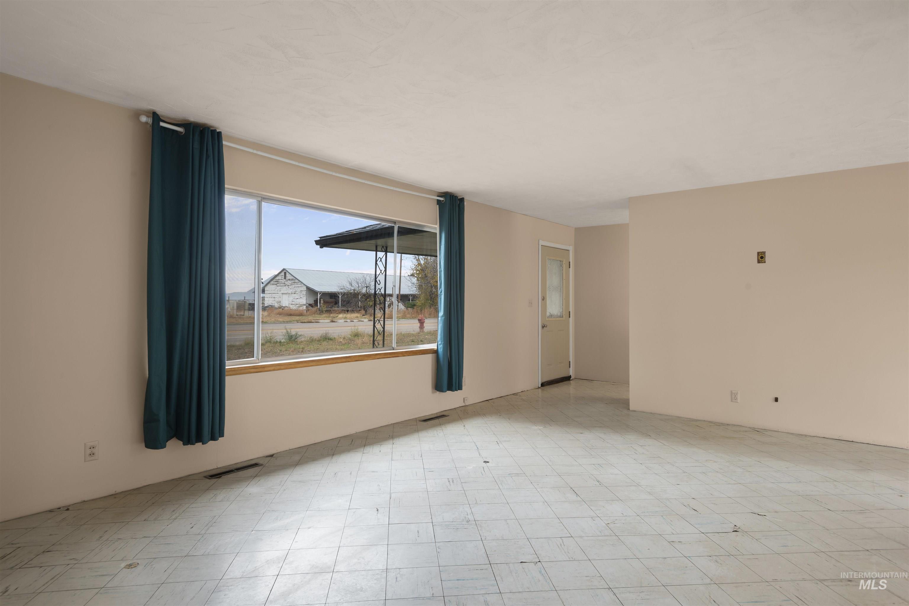 Empty room featuring light flooring