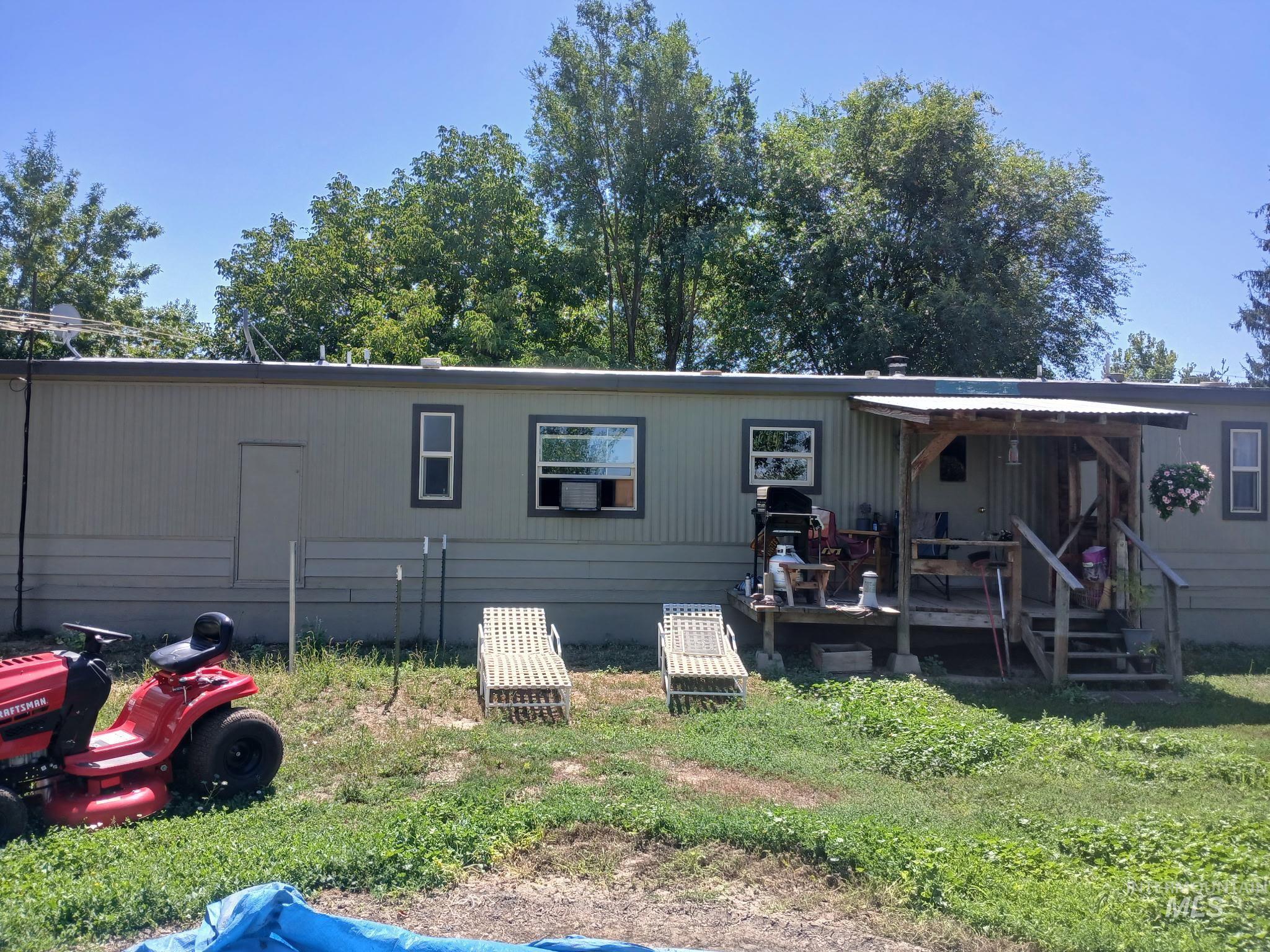 Rear view of house with a wooden deck