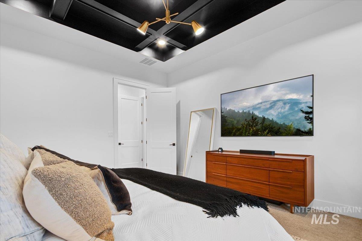 Bedroom with carpet and baseboards