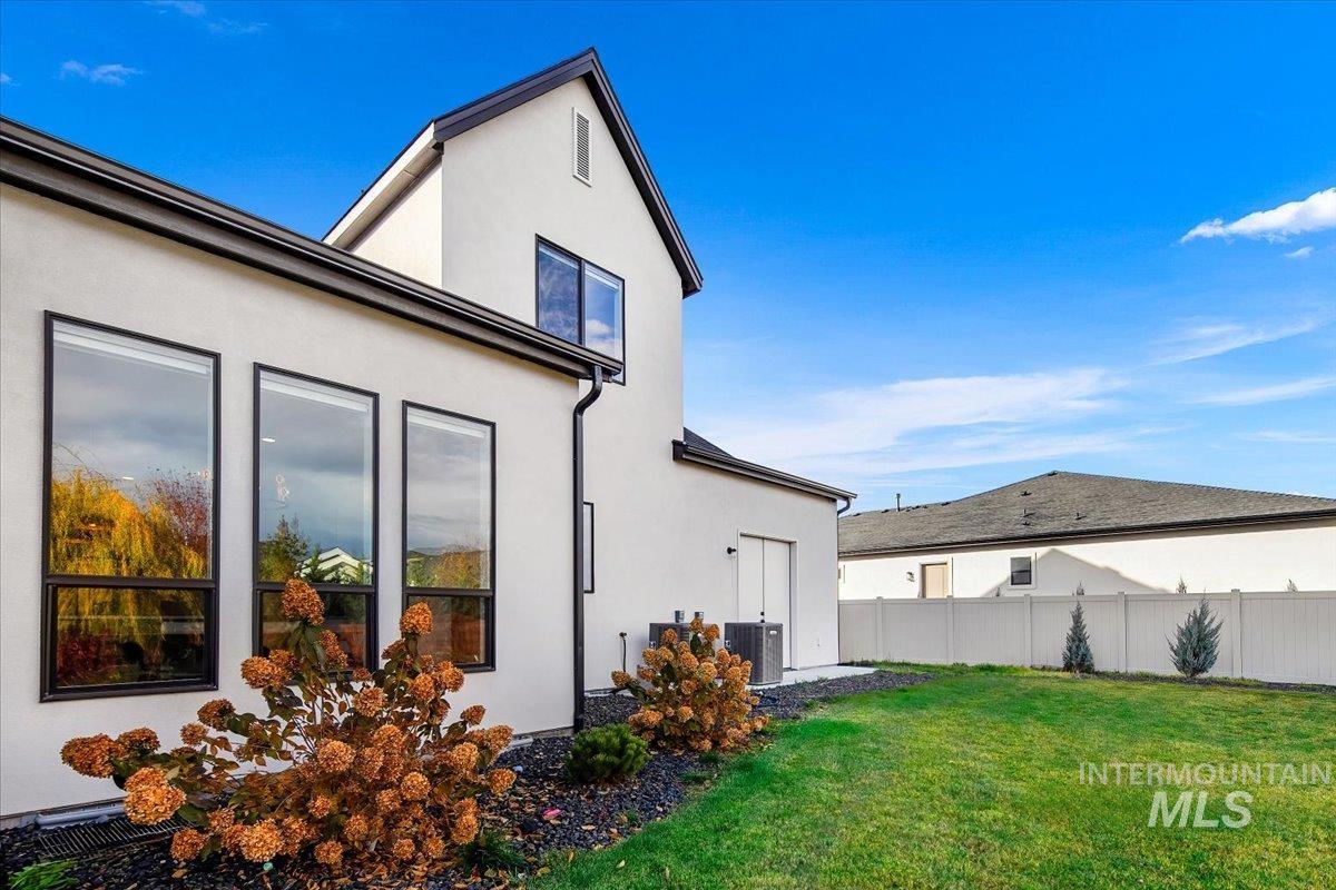 View of property exterior featuring stucco siding and a central air condition unit