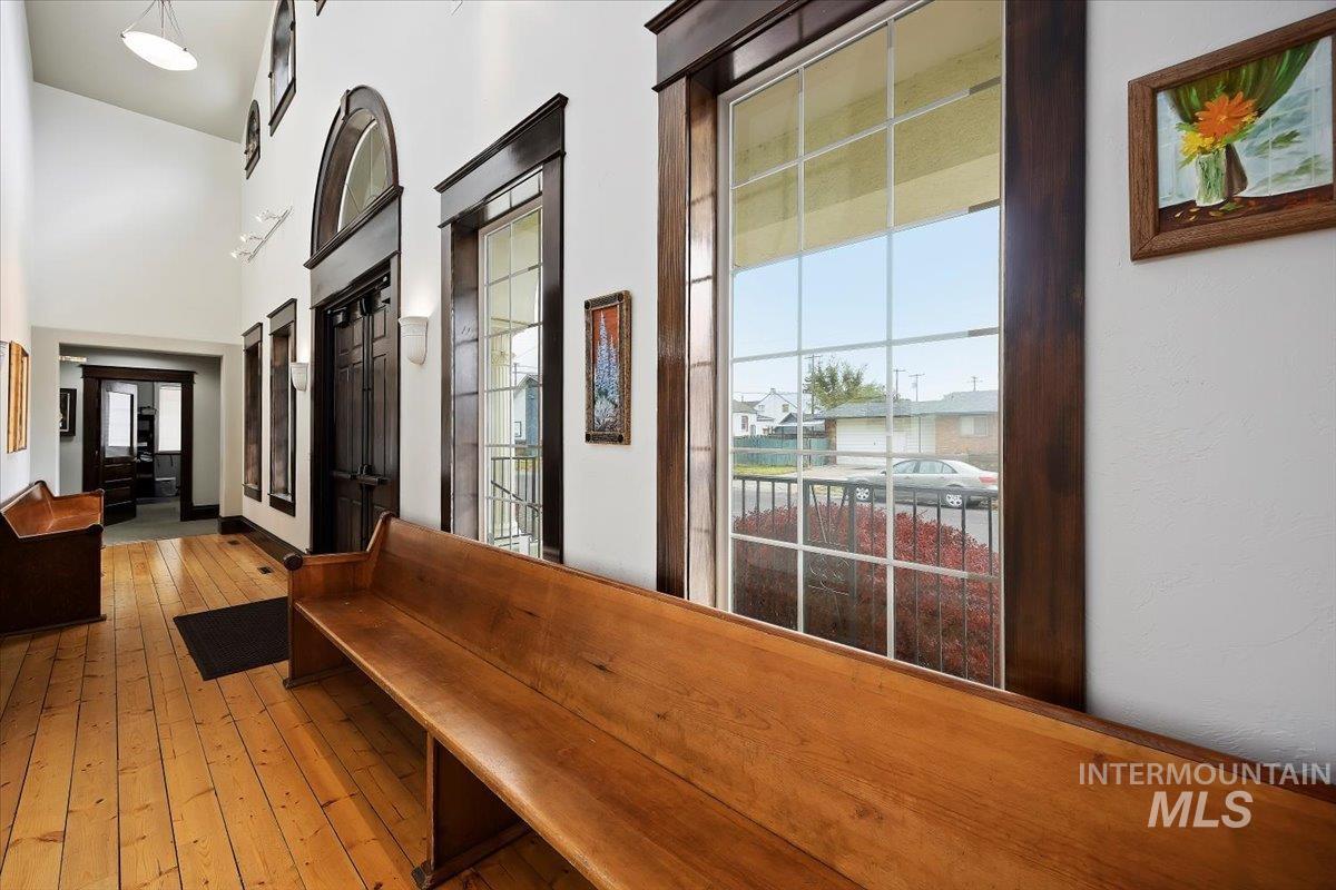 Corridor featuring light wood-style floors